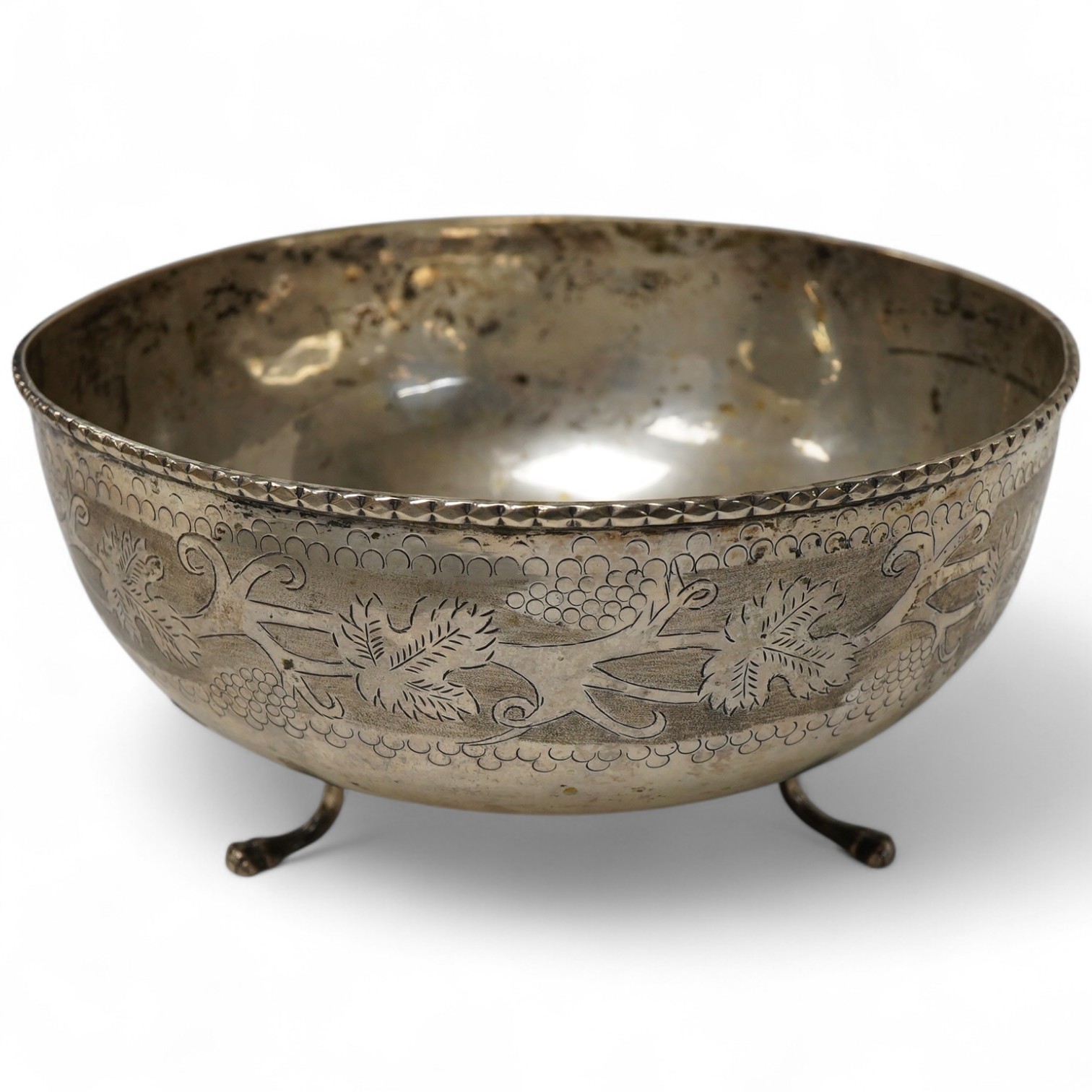 A continental circular white metal bowl with engraved fruiting vine decoration, diameter 19.8cm, 14oz.